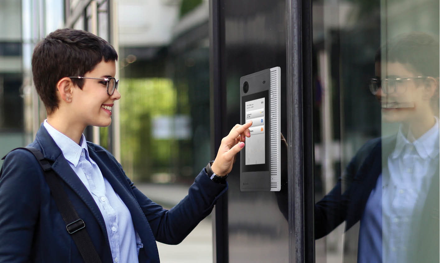 Business woman touch door entry intercom