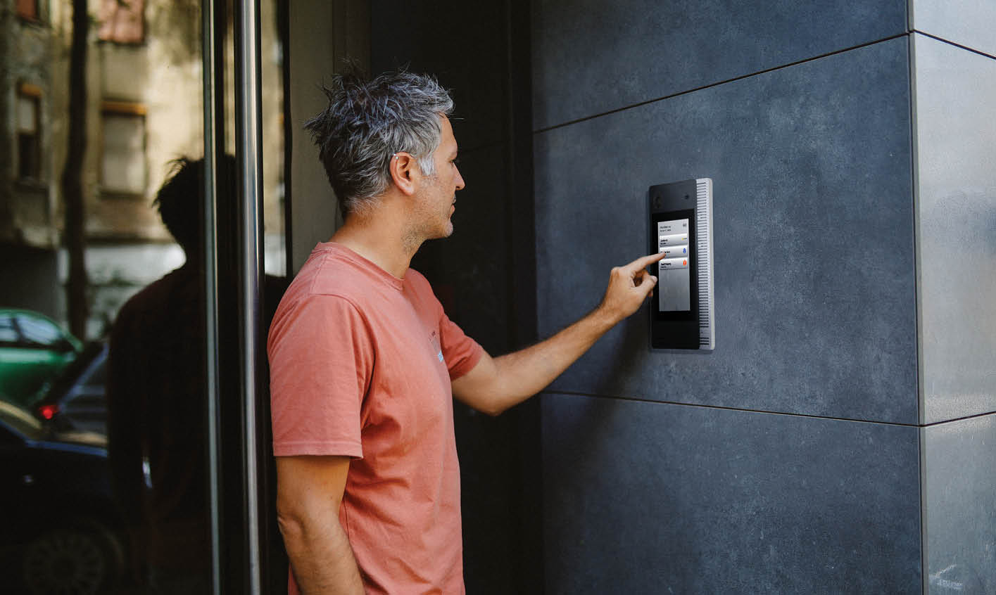 Man calling on door entry intercom