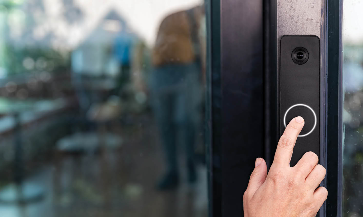 Hand press on door entry intercom in a storage